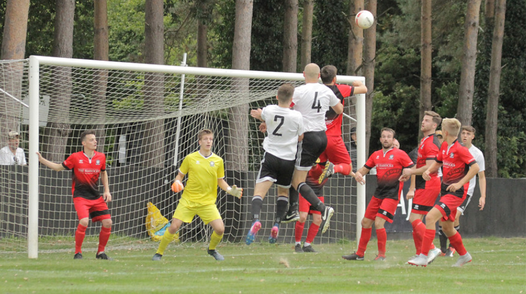 Hassocks defend a set piece away at Loxwood