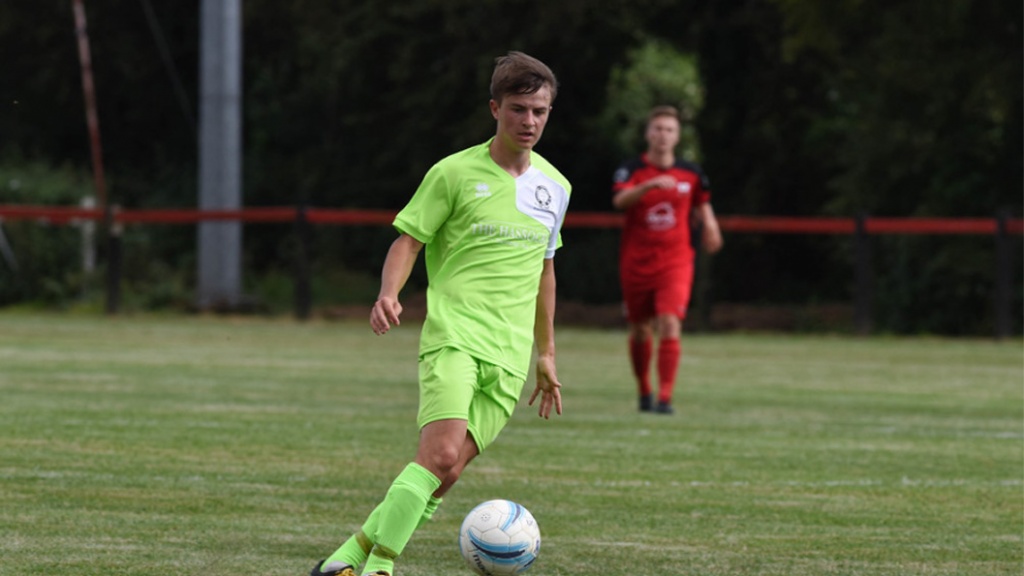 Dan Stokes on the ball for Hassocks against Wick