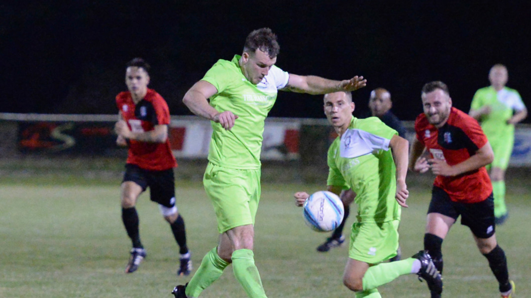 Hassocks' Nathan Miles brings the ball under control against AFC Uckfield Town