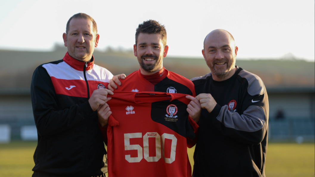Ashley Marsh is presented with a special shirt before his 500th game for Hassocks