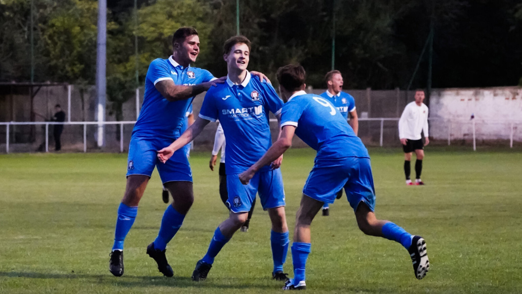 Hassocks players celebrate James Littlejohn scoring against Balham in the FA Cup