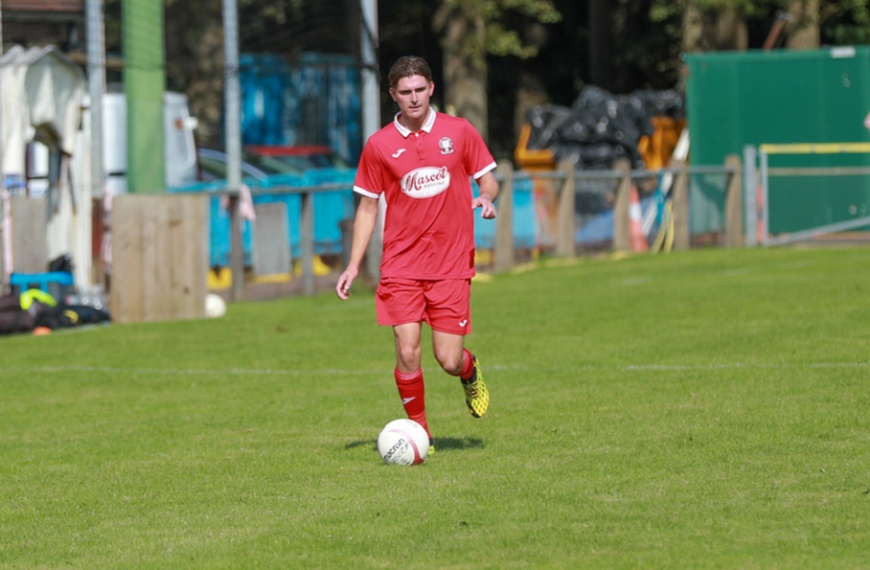 Bradley Tighe on the ball for Hassocks in their friendly against Sutton Common Rovers