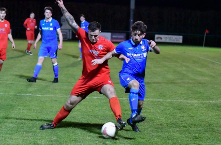 Hassocks defender Jack Baden puts in a tackle against Crawley Down Gatwick
