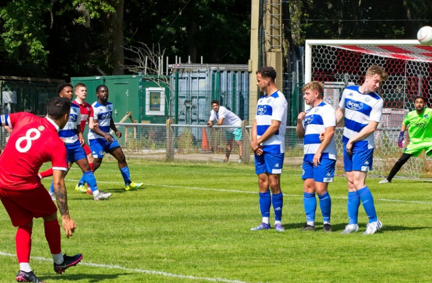 Lewis Westlake takes a free kick for Hassocks against Epsom & Ewell