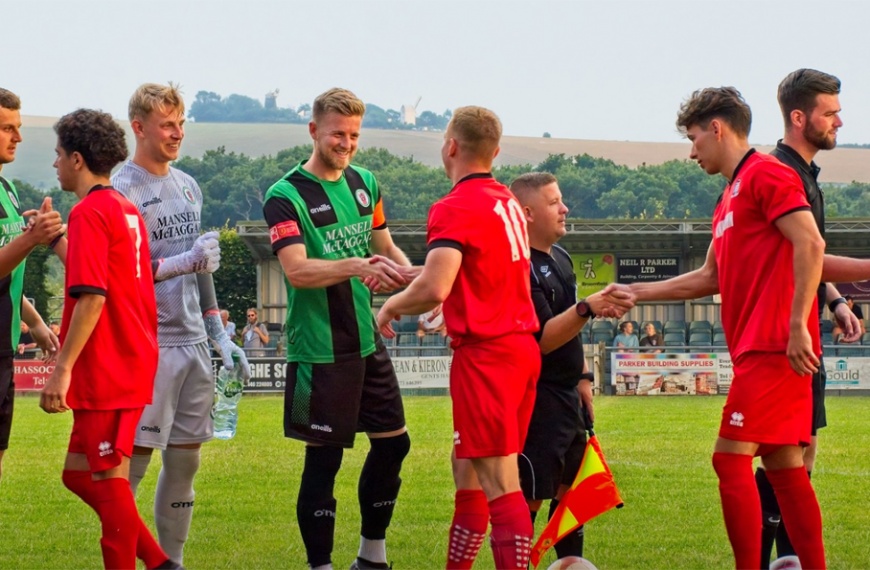 Pat Harding shakes hands with former Burgess Hill Town team mates