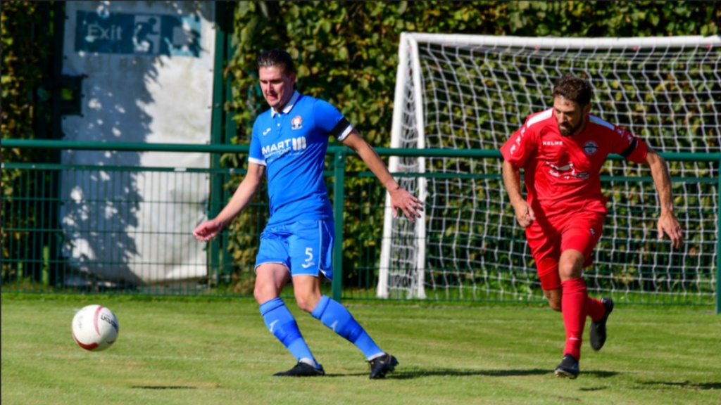 Hassocks defender Bradley Tighe in action against Crawley Down Gatwick