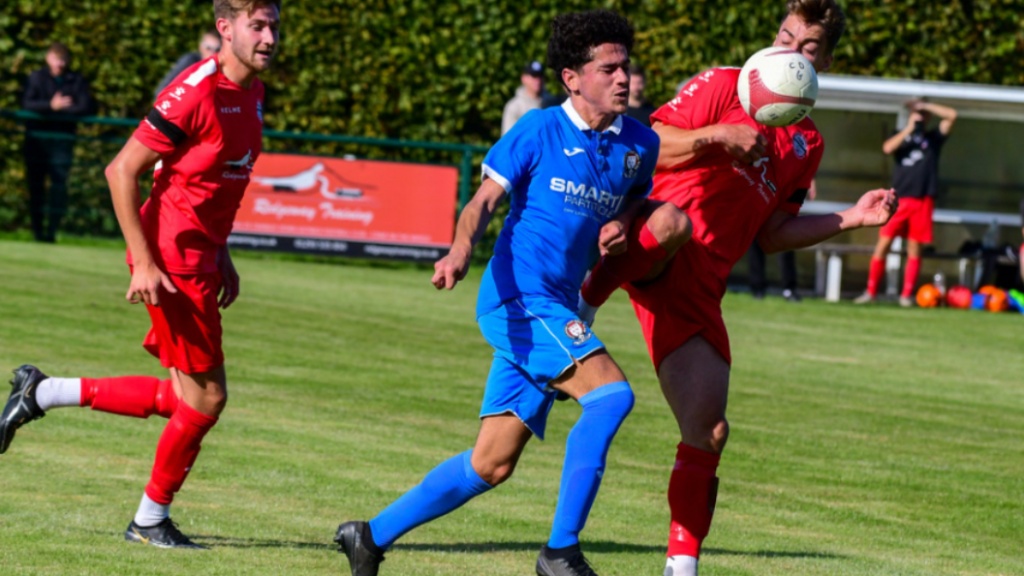 Leon Turner runs with the ball for Hassocks against Crawley Down Gatwick