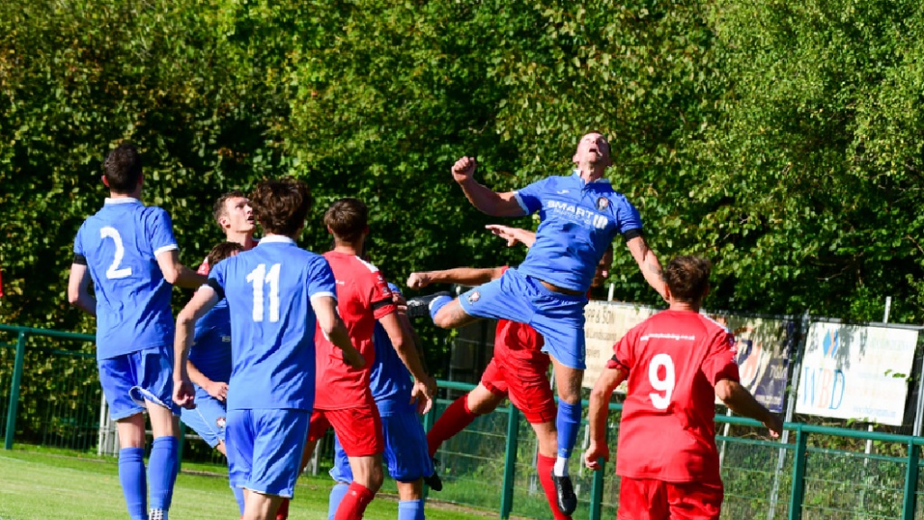 Alex Bygraves wins a header as the Hassocks defence comes under pressure from Crawley Down Gatwick