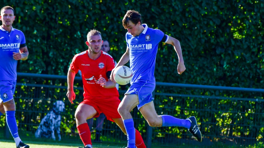 Jack Troak runs with the ball for Hassocks against Crawley Down Gatwick