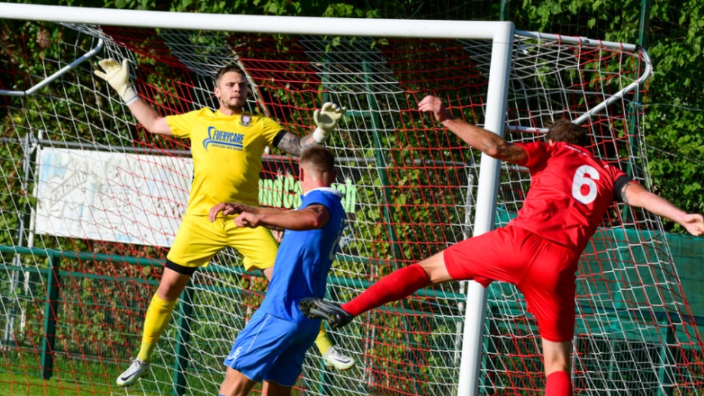 Hassocks goalkeeper Alex Harris in action against Crawley Down Gatwick