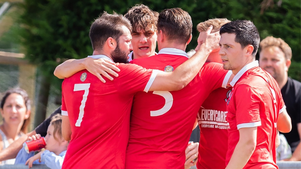 Hassocks celebrate taking the lead against Uxbridge in the FA Cup