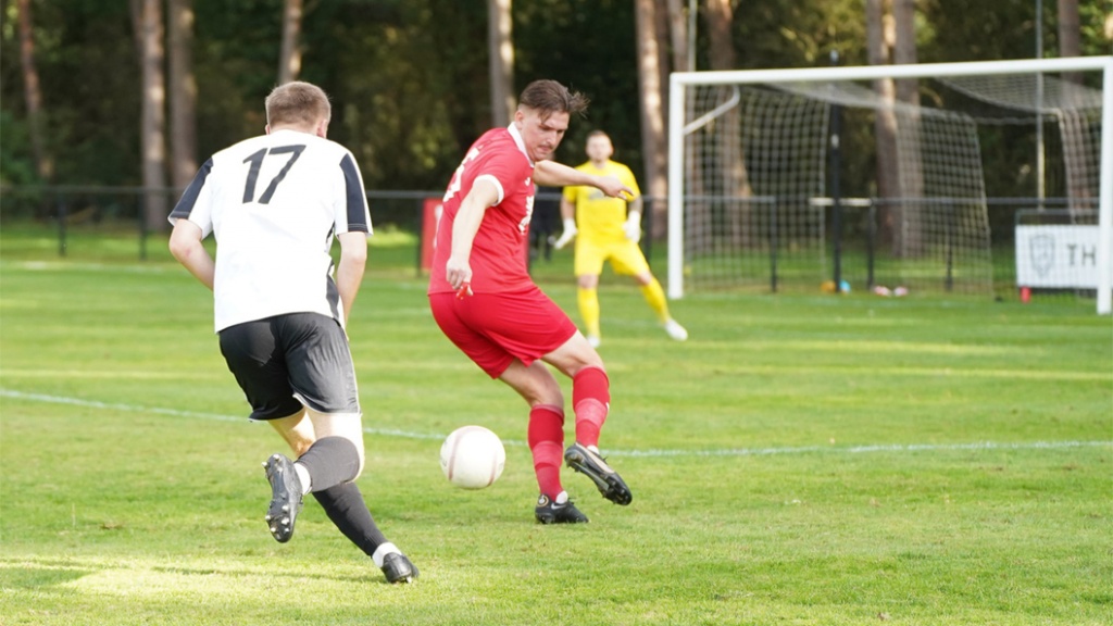 Bradley Tighe defends for Hassocks against Loxwood