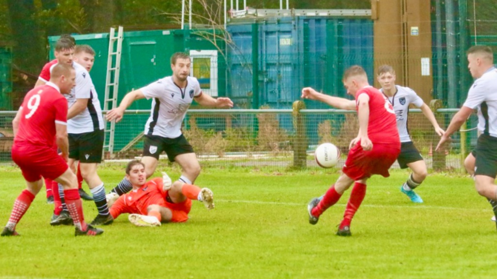 Jamie Wilkes takes a shot for Hassocks against Bexhill United