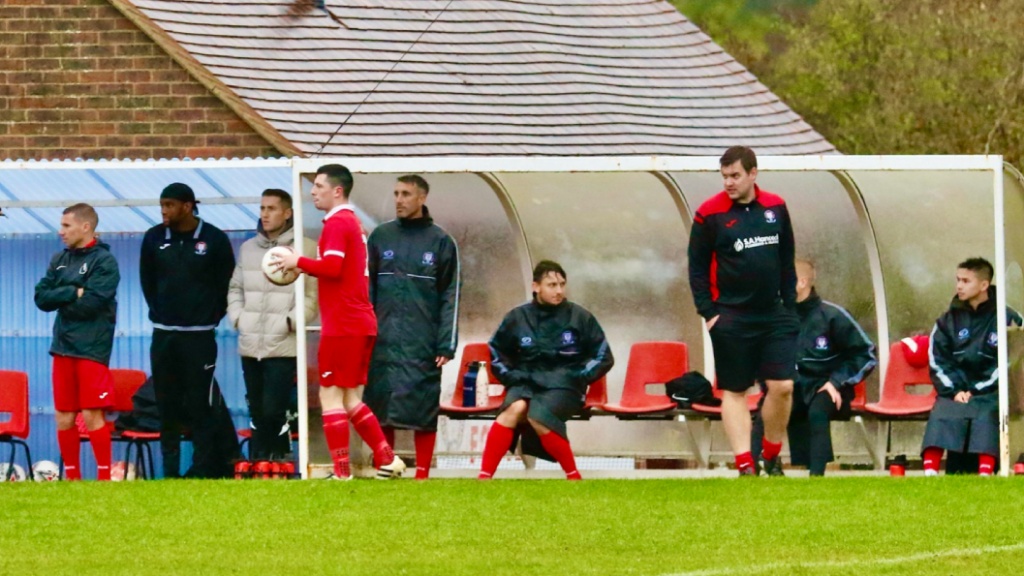 The Hassocks bench watches on as the Robins take on Bexhill United