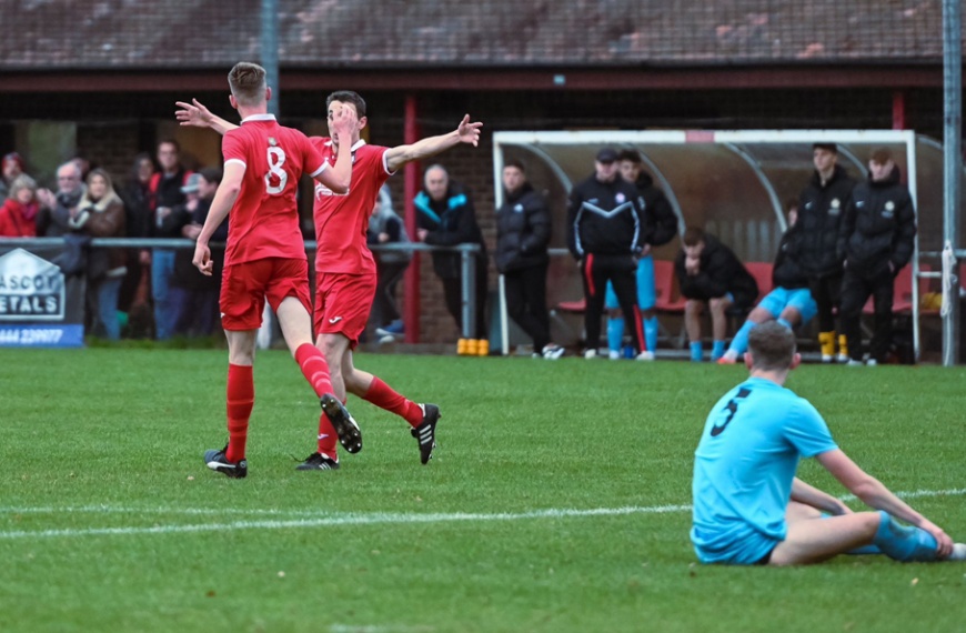 Jamie Wilkes and Jack Troak celebrate Hassocks scoring against Saltdean United