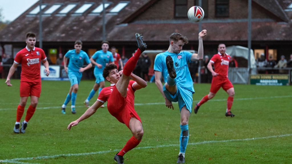 Liam Benson hooks a ball acrobatically back into area for Hassocks against Saltdean United