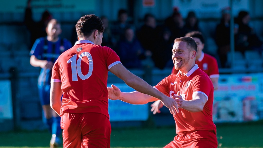 Liam Benson and Pat Harding celebrate a Hassocks goal against Steyning Town