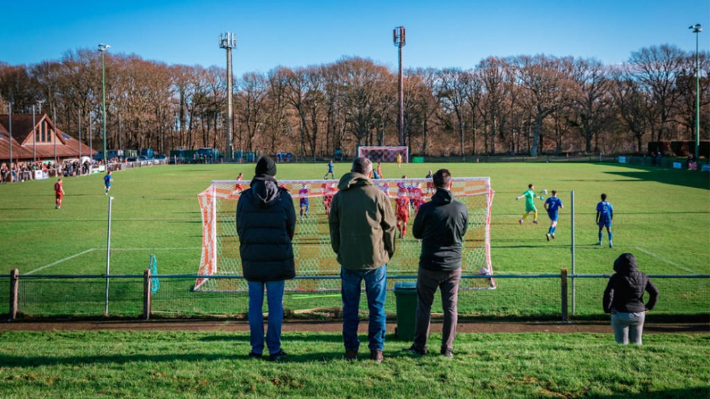 Supporters watching Hassocks play  against Steyning Town at the Beacon