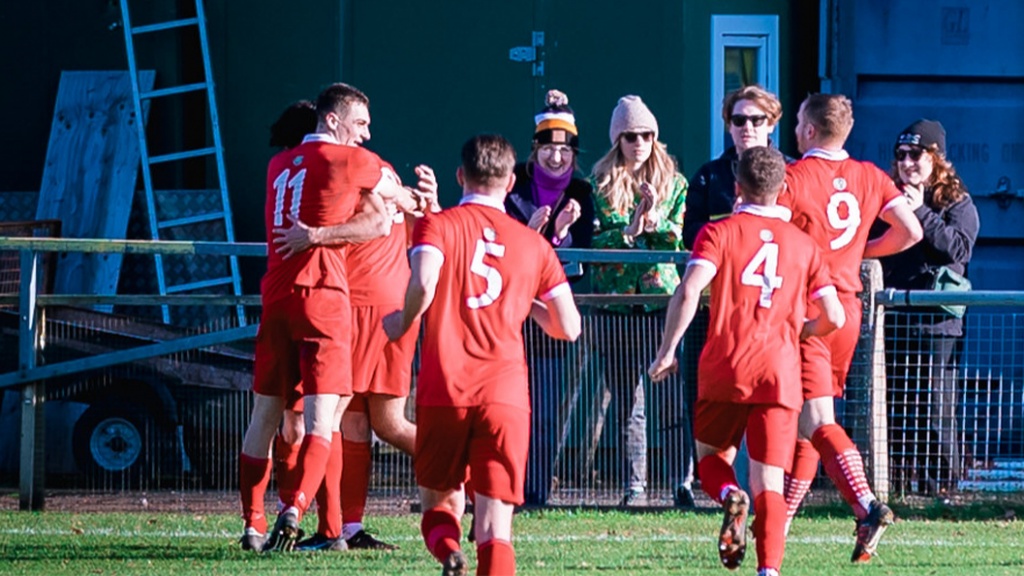 Hassocks players celebrate scoring their second goal  against Steyning Town