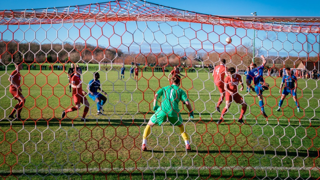 Hassocks defend their goal against Steyning Town