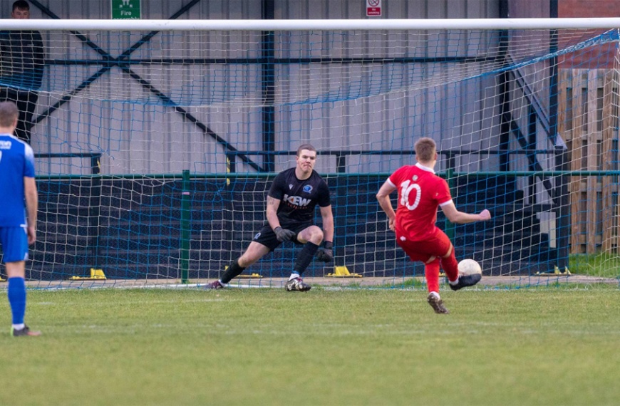 Phil Johnson successfully converts a penalty for Hassocks at Broadbridge Heath