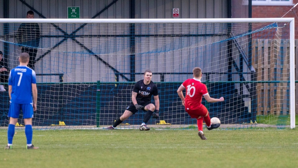 Phil Johnson converts a penalty for Hassocks in a 2-1 defeat against Broadbridge Heath