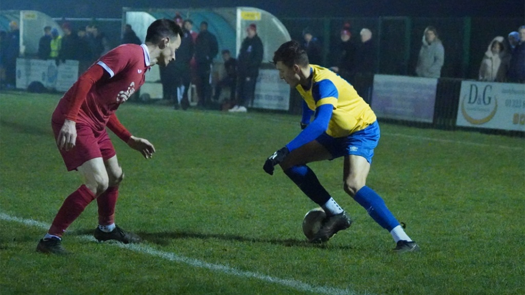 Harvey Blake in action for Hassocks against Eastbourne Town