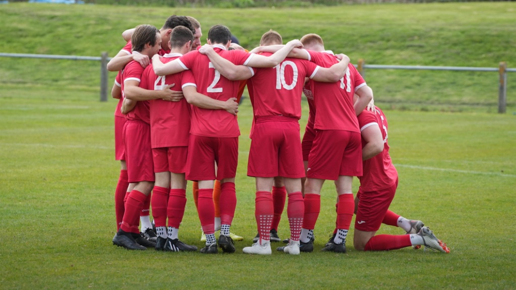 Hassocks players in a huddle before their game against Eastbourne Town