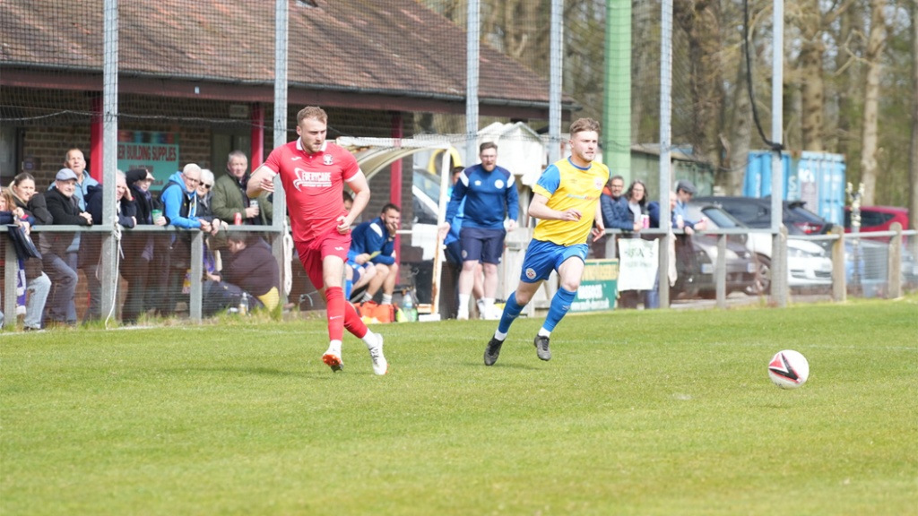 Sam Smith on the ball for Hassocks against Eastbourne Town