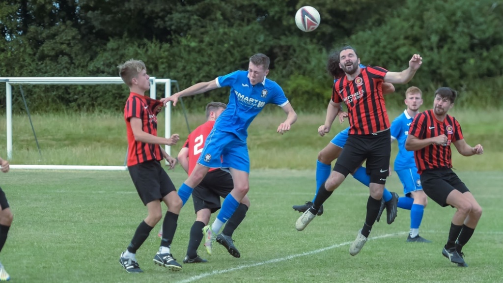Billingshurst defend a Hassocks corner into the box during a pre-season game at Jubilee Fields