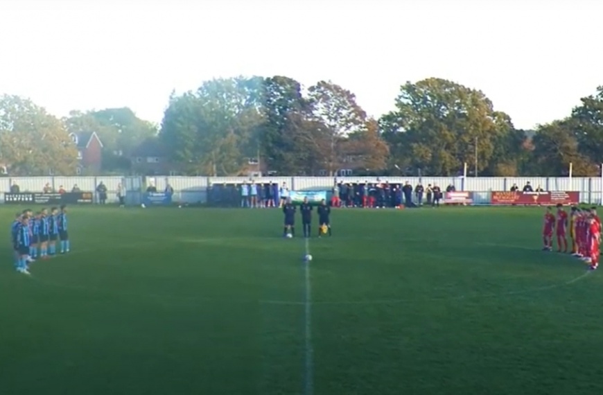 Crowborough Athletic and Hassocks stand for a minutes silence for Armistice Day