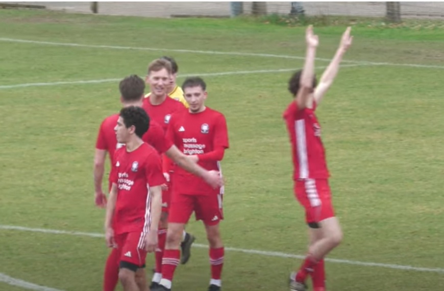 Jack Troak tries to claim he has scored for Hassocks in their 3-1 win over Pagham