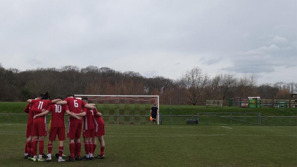 Hassocks players in a huddle before their Southern Combination Premier Division game with Eastbourne United