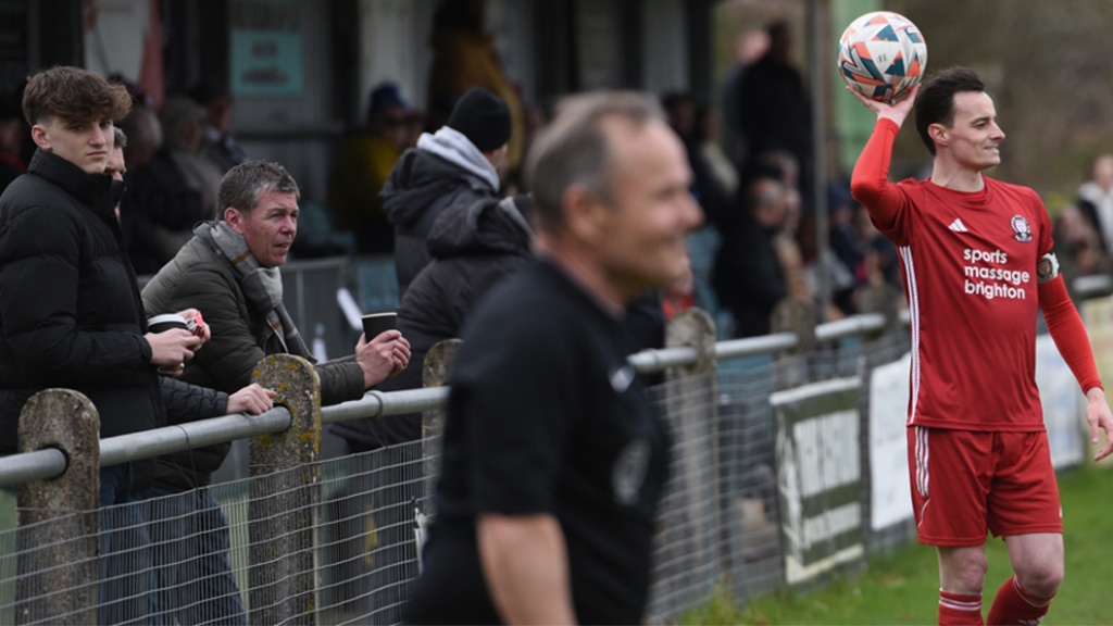 Hassocks right back Harvey Blake prepares to take a throw