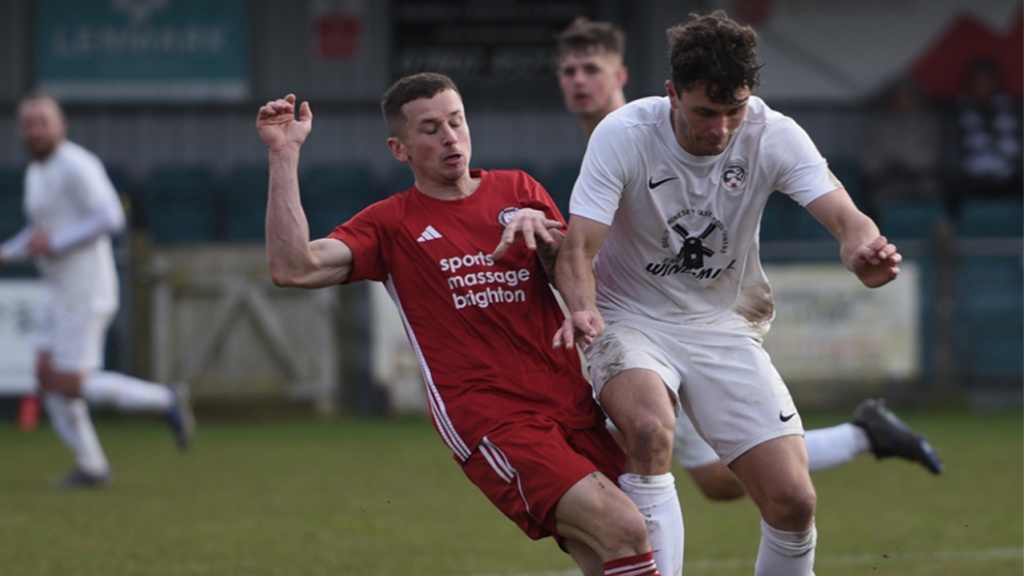 Hassocks midfielder Mike Williamson in action against Eastbourne United