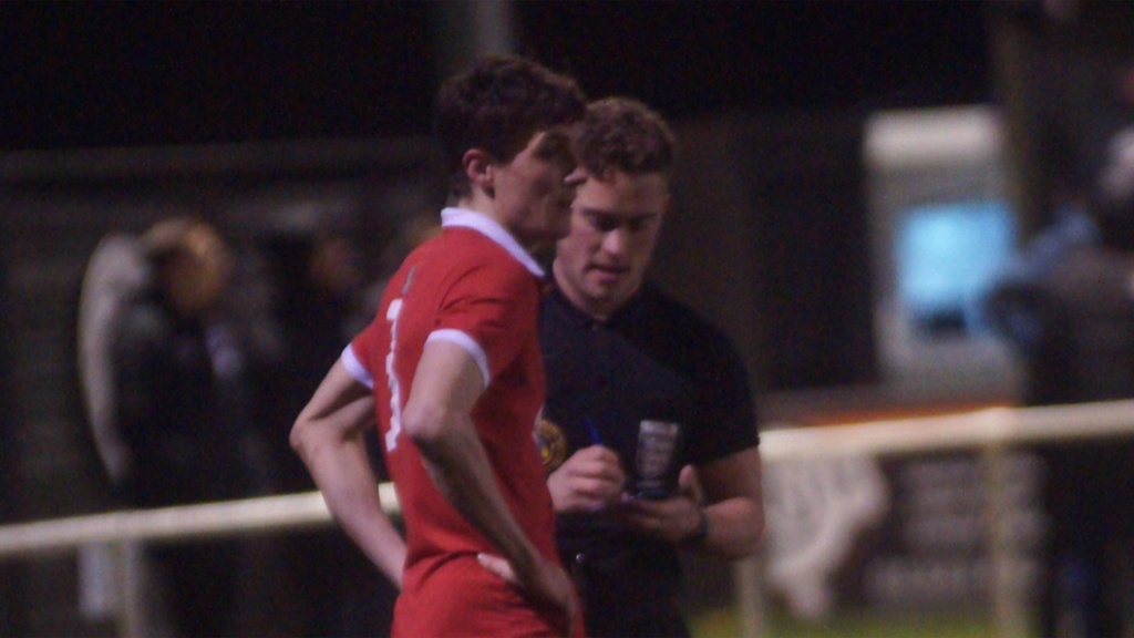 Jack Troak receives a talking to from a referee during Eastbourne United 1-1 Hassocks