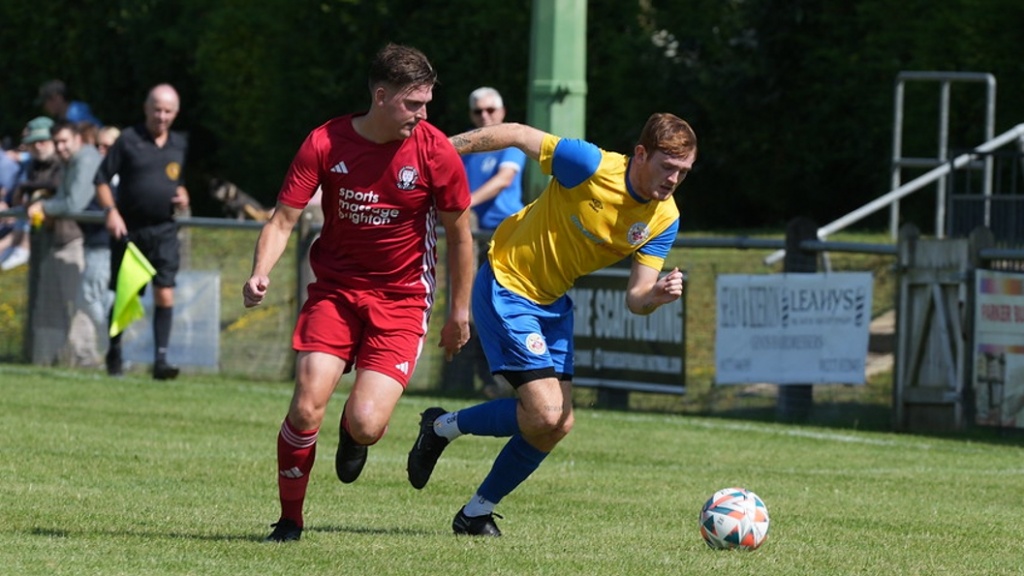 Bradley Tighe in action for Hassocks against Eastbourne Town