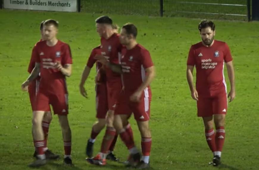 Hassocks celebrate Alex Fair scoring the opening goal in their 3-0 win at Loxwood