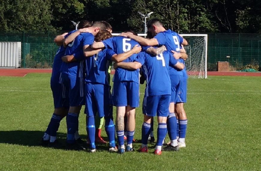 Hassocks players in a huddle before their away game at AFC Varndeanians